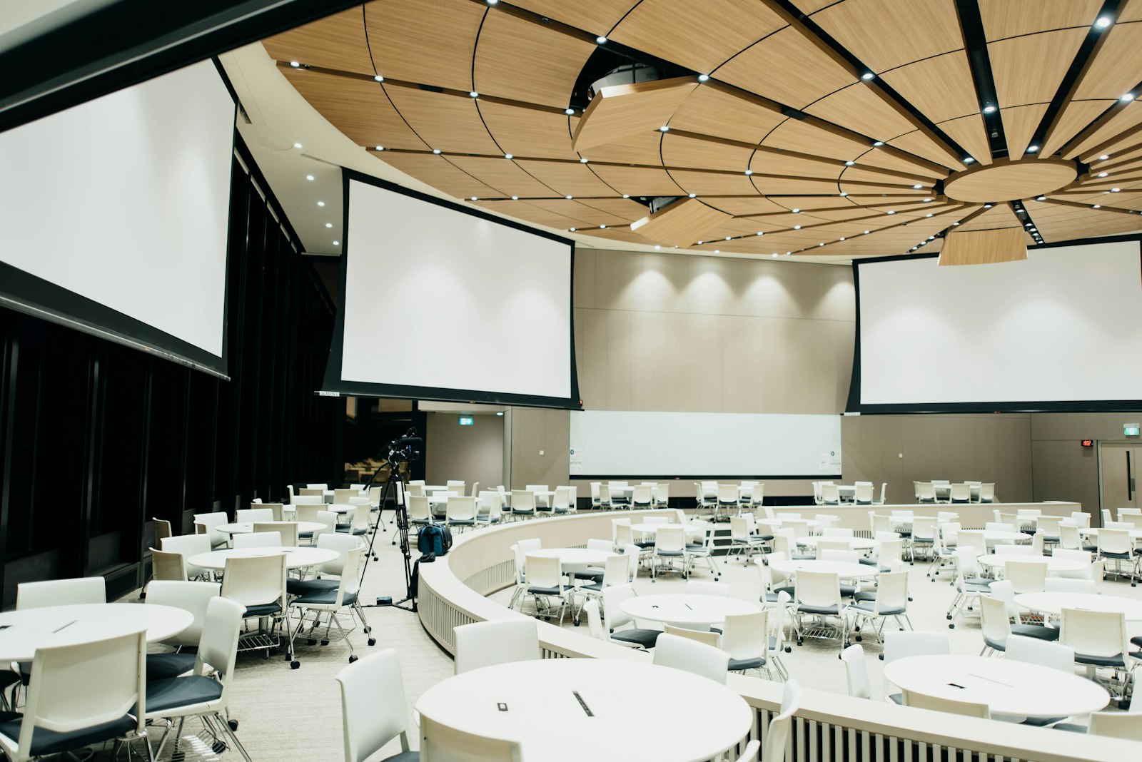 Audience seated in a conference hall during a professional speaking event